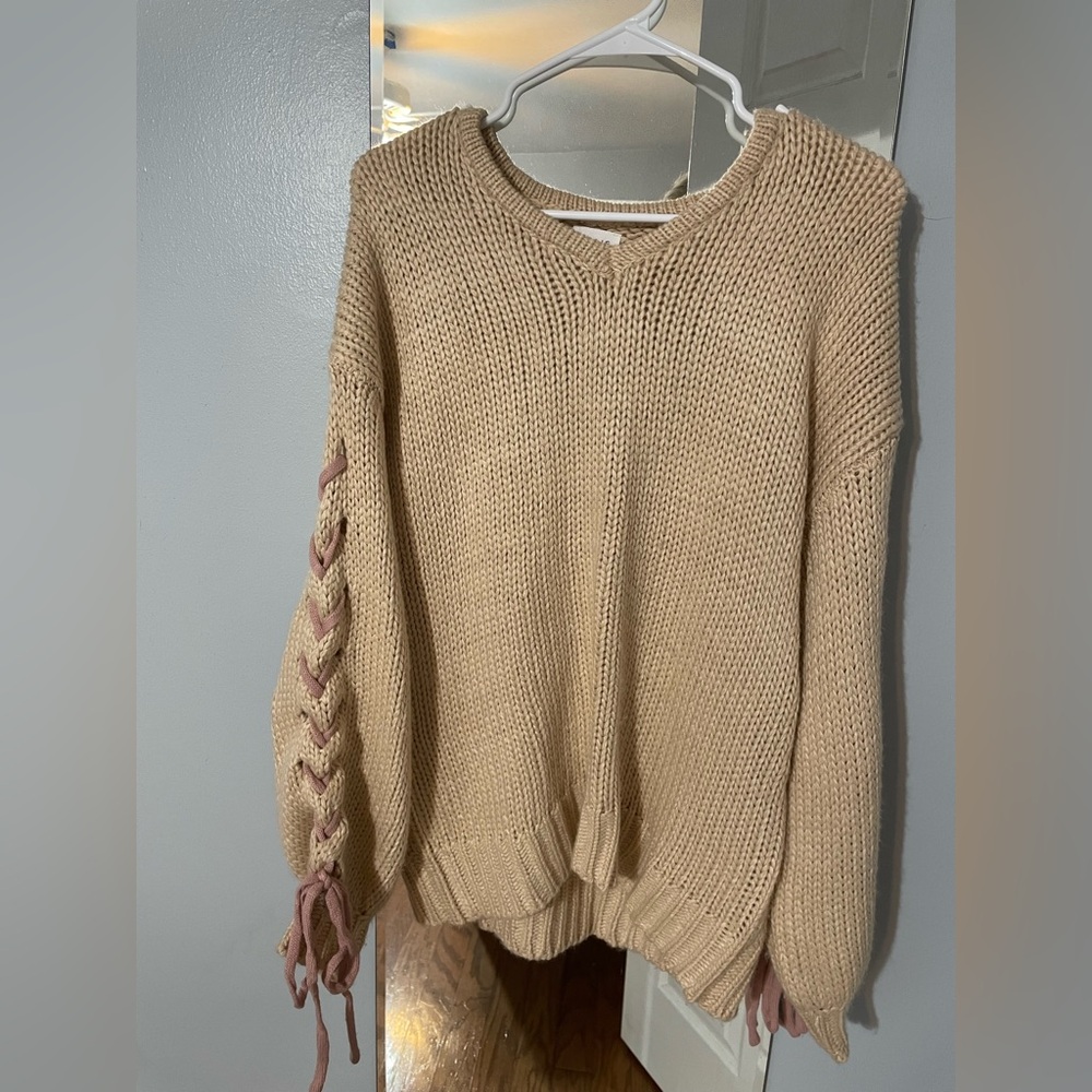 cable knit sweater with coquette bows on sleeves